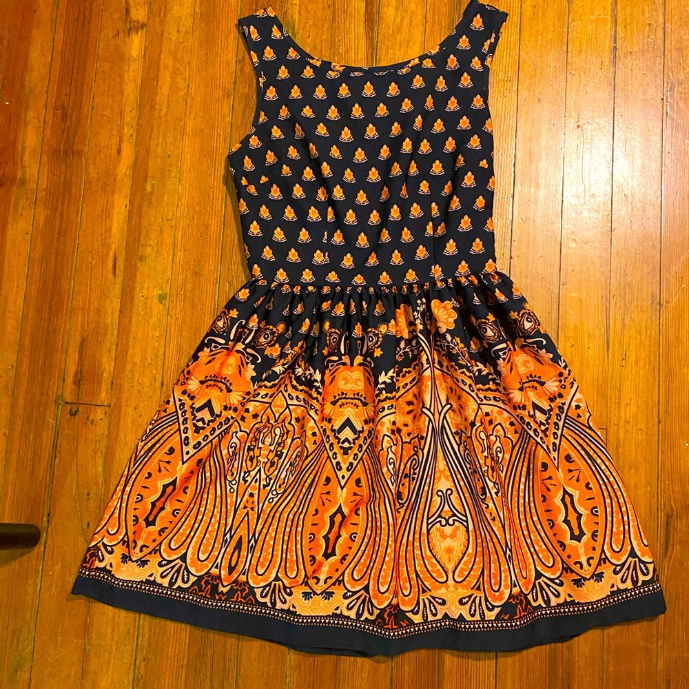 Knee length A-line patterned orange and navy dress